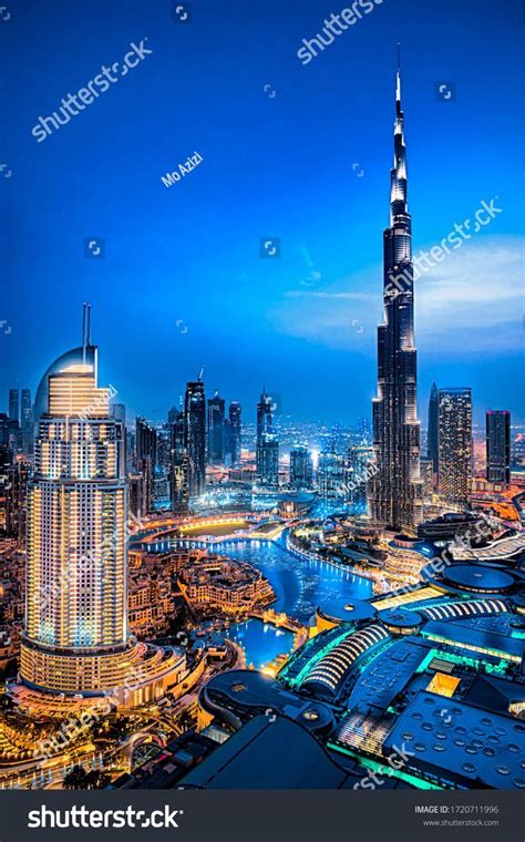 Ultra modern city of Dubai. Night view of Downtown. Tall buildings ...