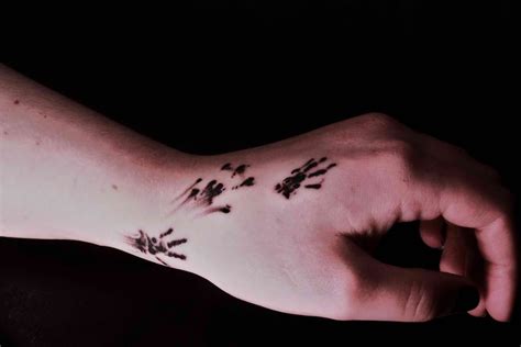 Check These 10 Paw Print Tattoo Ideas You Might Like To Have For Your ...