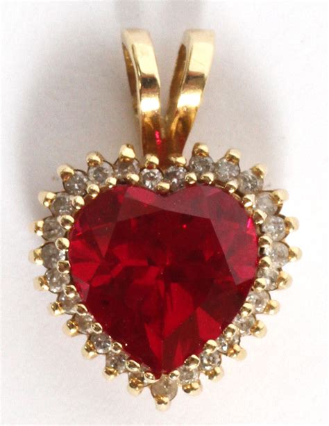 Sold At Auction 14kt Yellow Gold Diamond And Heart Shape Ruby Pendant