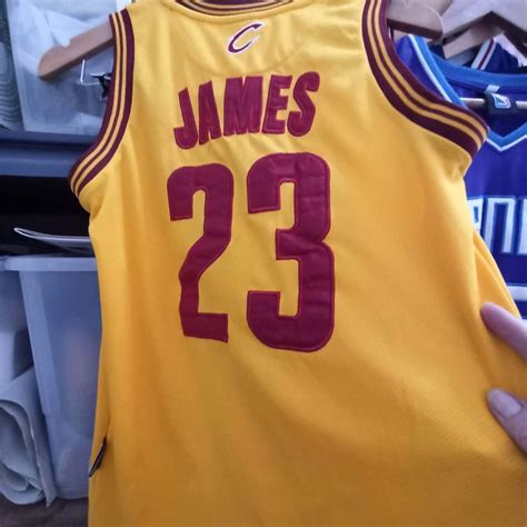 Cleveland, Cavaliers number 23 LeBron James, maroon and yellow NBA ...