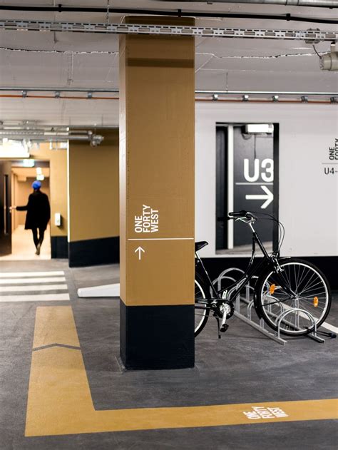 There Is A Bike That Is Parked In The Parking Garage Next To An Exit Sign