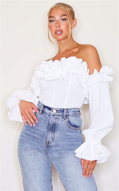 White Ruffle Hem Off Shoulder Long Sleeve Top Tops Prettylittlething Ca