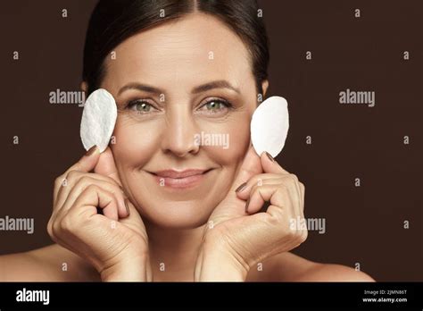 Beautiful Middle Aged Woman With A Cotton Pads For Face Cleaning Or