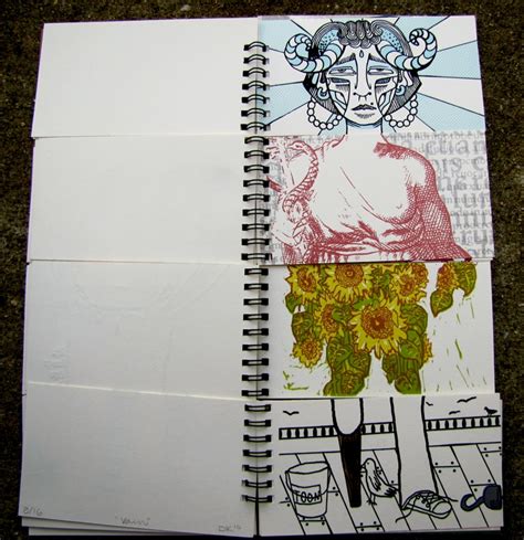 Two Notebooks With Drawings On Them Sitting Next To Each Other