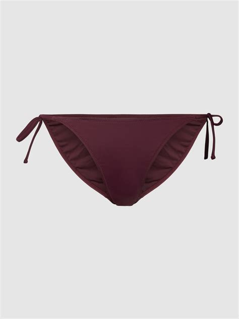 Kup online Guess Figi bikini z detalem z logo jasnośliwkowy