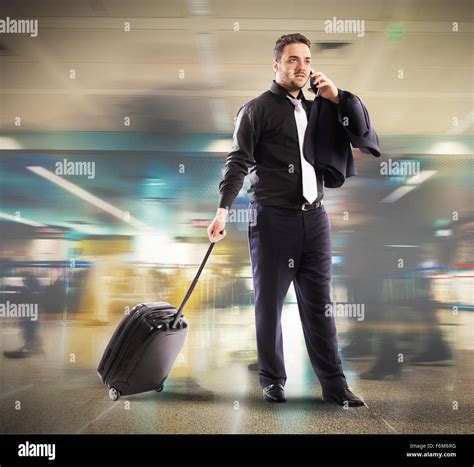 Busy Businessman In Airport Stock Photo Alamy