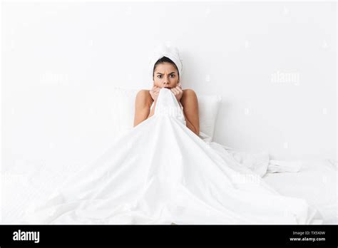 Image Of A Beautiful Scared Amazing Woman With Towel On Head Lies In