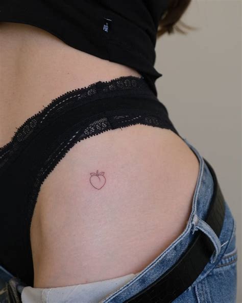 Tiny Minimalistic Peach Tattoo Placed On The Hip