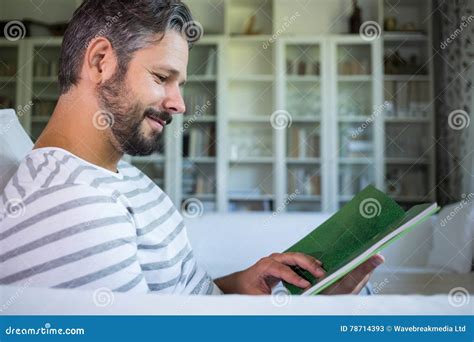 Father Looking At Photo Album In Living Room Stock Image Image Of