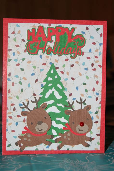 A Handmade Christmas Card With Two Reindeers On The Front And One Deer