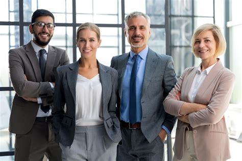 Premium Photo | Group of businesspeople standing together in office