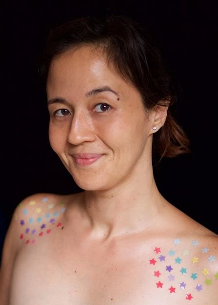 Premium Photo Portrait Of Shirtless Woman Against Black Background