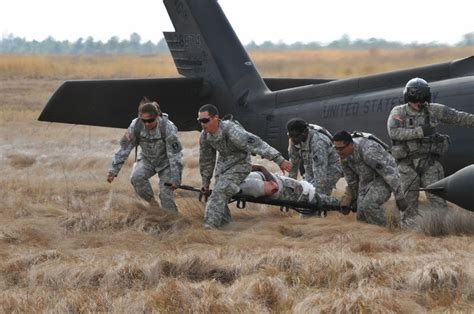 Combat Medic In Action Soldiers Sailors Marines Airmen And Soldier