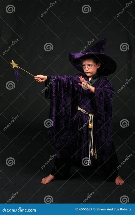 Wizard Boy With Magic Wand Casting A Spell Stock Image Image Of