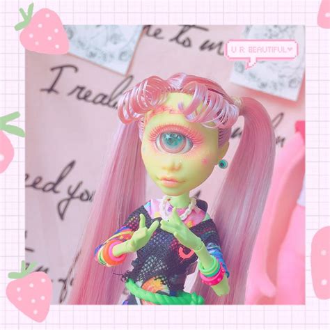 An Image Of A Doll With Pink Hair