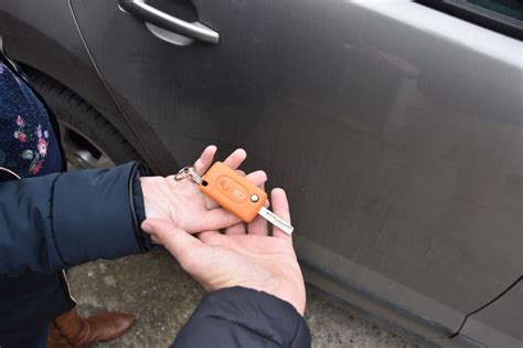 Car Sales One Person Sells Car And Gives The Key To The New Owner