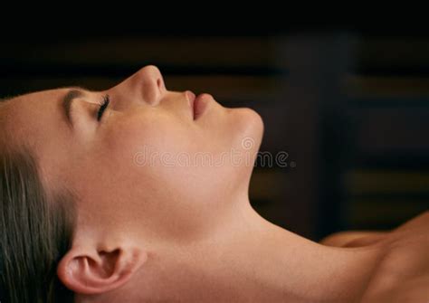 Total Relaxation Closeup Of A Young Womans Face During A Massage