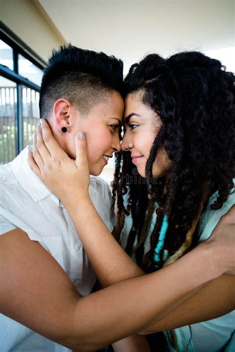 Lesbian Couple Embracing Each Other And Smiling Stock Image Image Of Indoors Couple 66973113