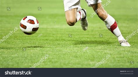 Soccer Player Running After Ball Stock Photo Edit Now 58421233