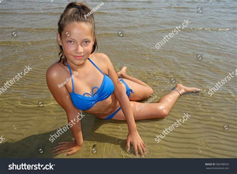 Young Girl Lying On Sandy Beach Stock Photo 586398935 | Shutterstock