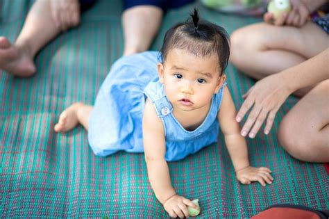 Premium Photo High Angle Portrait Of Cute Baby Girl Crawling On Mat