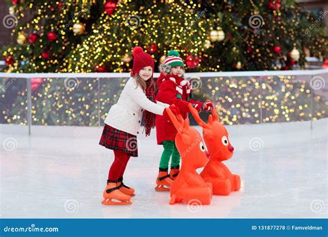 Kids Ice Skating in Winter. Ice Skates for Child Stock Photo - Image of ...