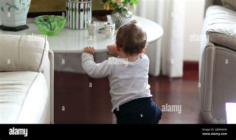 Baby Learning To Stand Infant Standing Up Holding Into Table Furniture