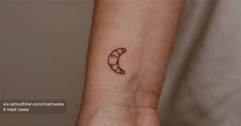 Minimalistic Croissant Tattoo Located On The Wrist