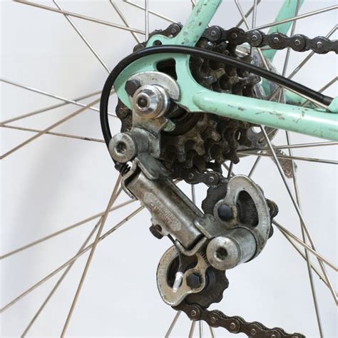 the front wheel of a bicycle with chain and sprocking gear attached to it