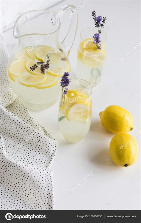 Lemonade in glasses and jar — Stock Photo © AntonMatyukha #159958630