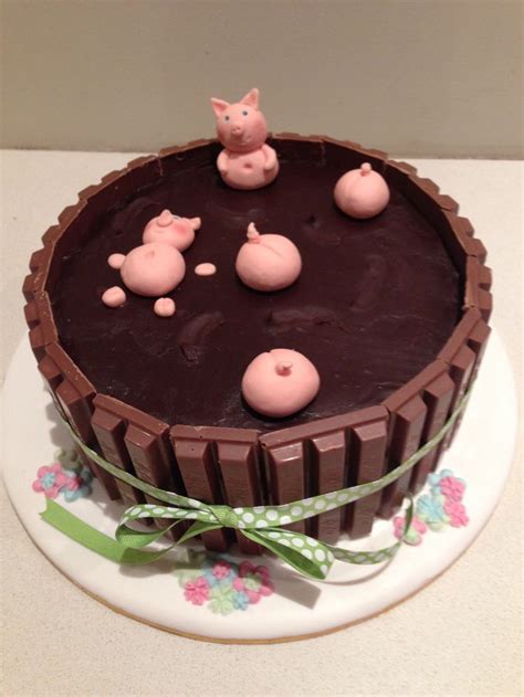 there is a chocolate cake with pigs on it