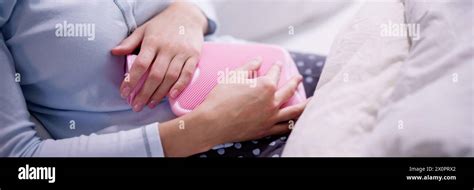 Woman In Hot Water Abdominal Pain Relief Stock Photo Alamy