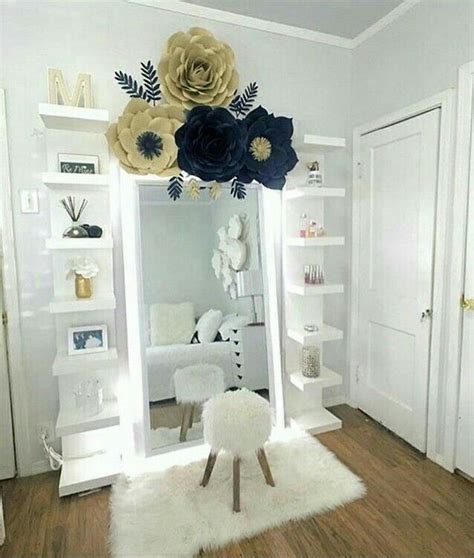 A Mirror With Flowers On It And A Sheepskin Rug In Front Of The Mirror