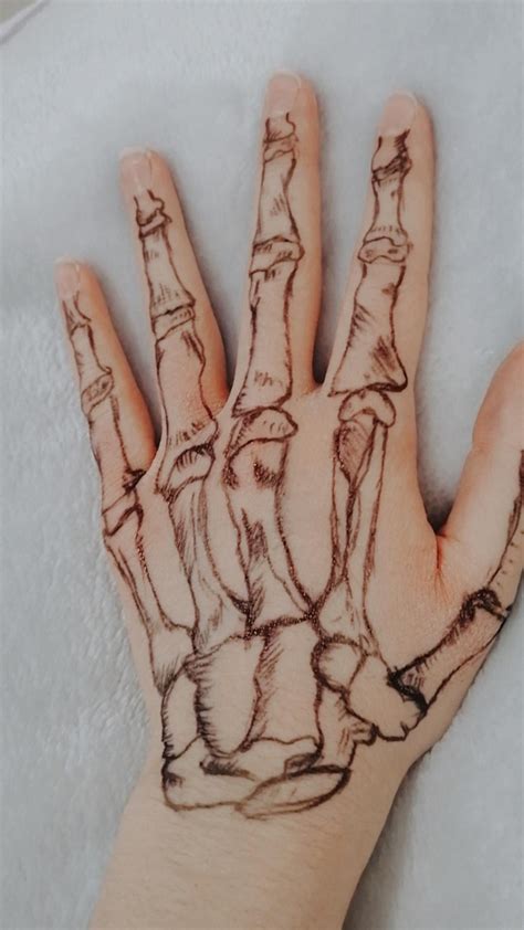 Skeleton hand tattoo | Skeleton hand tattoo, Skeleton hands drawing ...