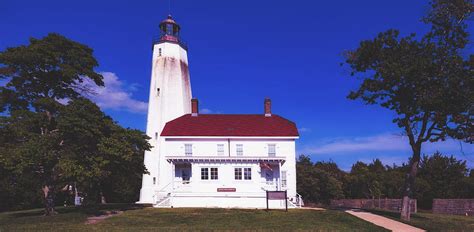 Fort Hancock Lighthouse - Sandy Hook, New Jersey Photograph by Mountain ...