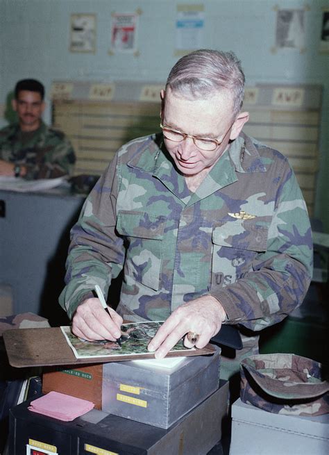 General (GEN) P.X. Kelley, commandant of the Marine Corps, autographs a ...