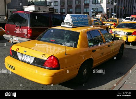 A Typical New York City Licensed Yellow Taxi Cab Car Waits For A Stock