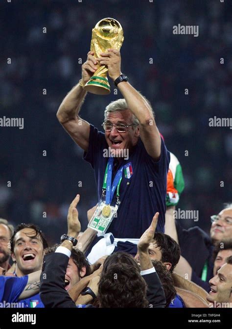 Italy's coach Marcello Lippi lifts the World Cup after the final of the ...