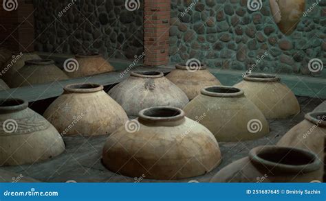 Ancient Jugs For Wine Buried In The Ground Ceramic Large Jugs Stock