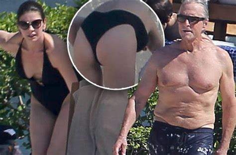 Catherine Zeta Jones Bares Her Butt Cleavage In A Plunging Bikini