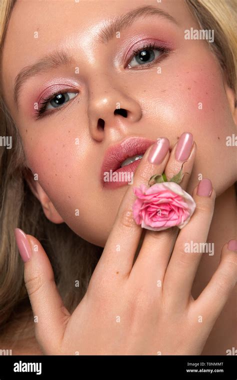 Close Up Blonde Female With Flower Stock Photo Alamy