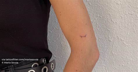 Tiny Minimalistic Skateboard Tattoo Located On The