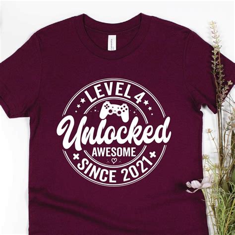 Hot Trending T Shirt With 4Th Birthday Shirt Level 4 Unlocked Awesome Since 2021 Shirt Turning
