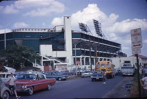 Cars Are Parked In Front Of An Old Baseball Stadium