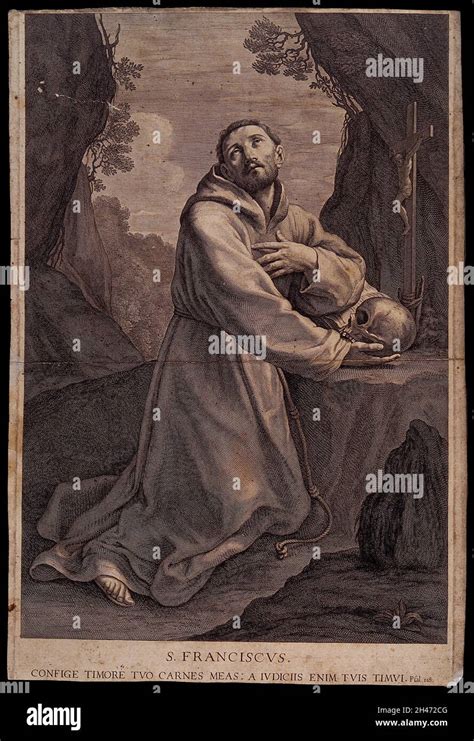 Saint Francis Of Assisi In The Wilderness Holding A Skull Kneeling In Front Of A Crucifix