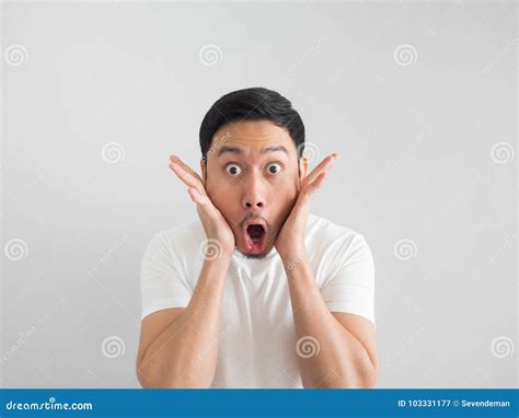 Shocked Face Of Man In White Shirt On Grey Background Stock Image