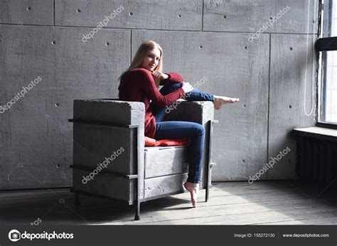 Beautiful Blonde Posing In A Chair Stock Photo Igor Yk