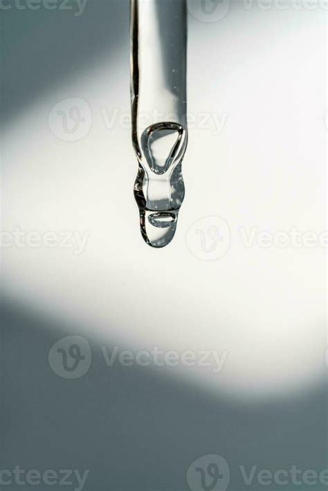 A Drop Of Cosmetic Oil Falls From The Pipette Stock Photo At