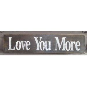 a metal sign that says love you more