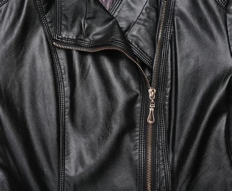 Textura De Chaqueta Negra De Cuero Con Cremallera Foto Premium